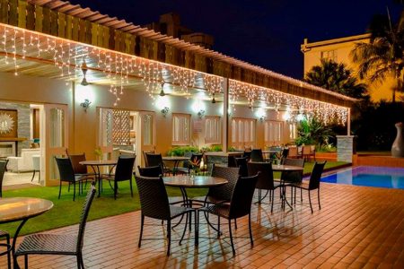 Hotel restaurant with pool and fairy lights